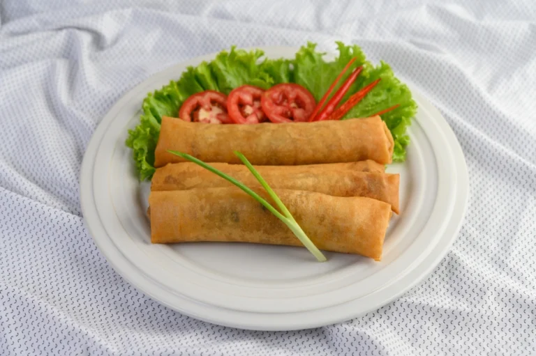 Egg roll fried spring rolls white plate Thai food